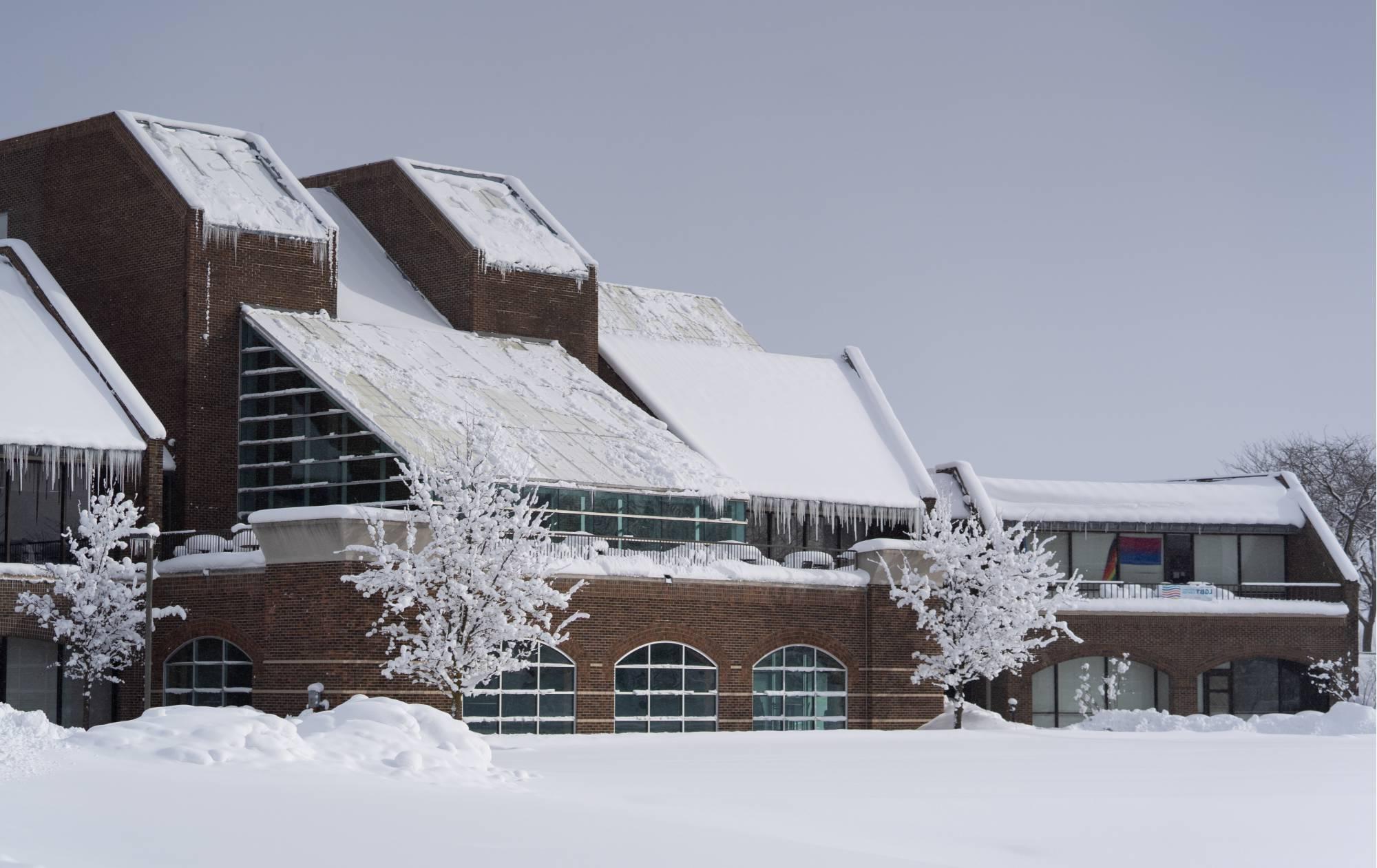 The Kirkhof Center on GVSU's Allendale Campus in the winter with snow on the ground